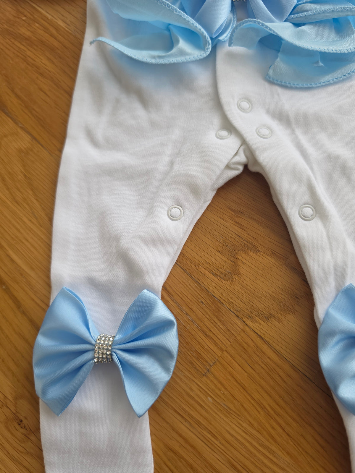 Blue ruffle babygrow