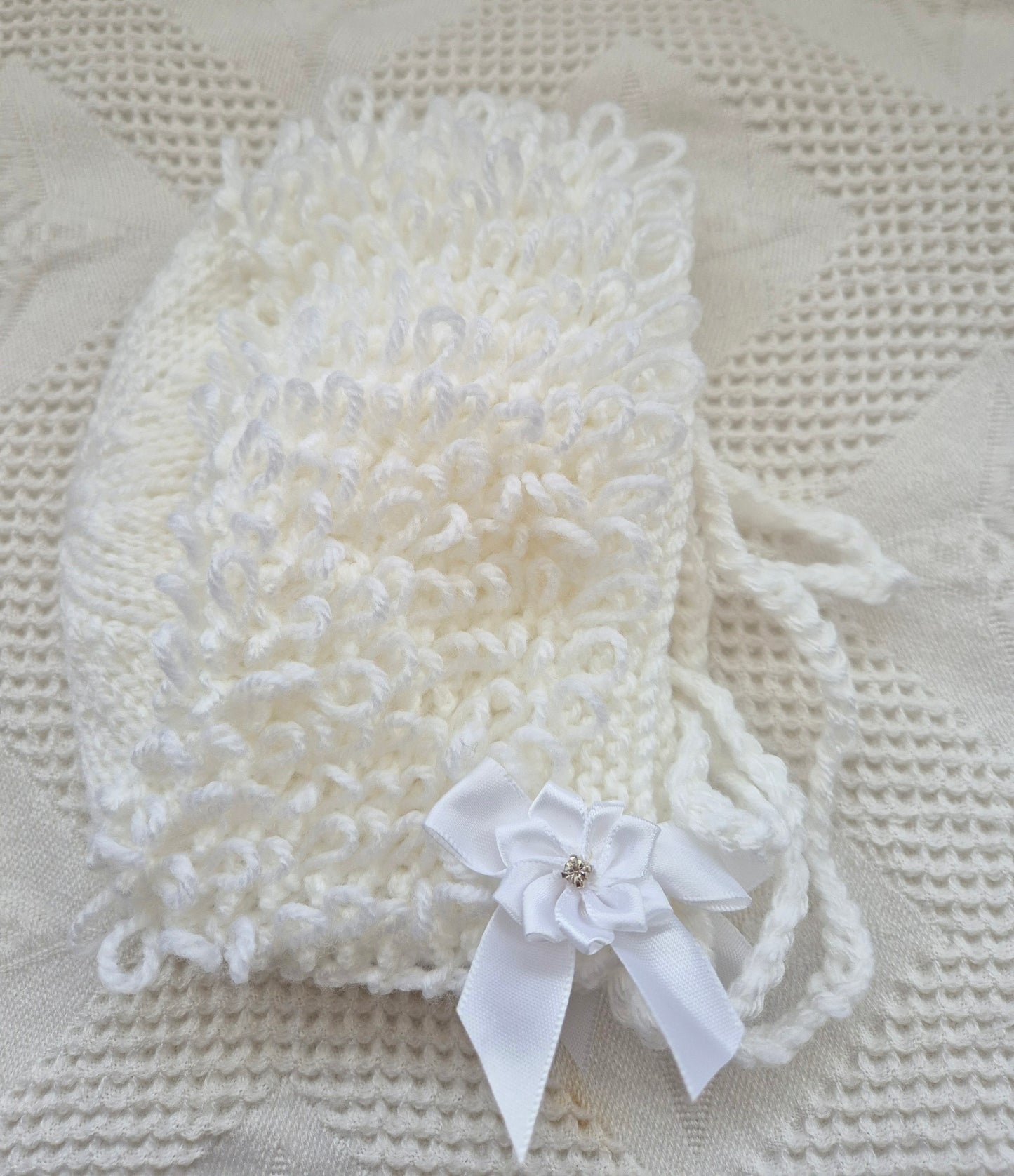 White loopy hat and booties