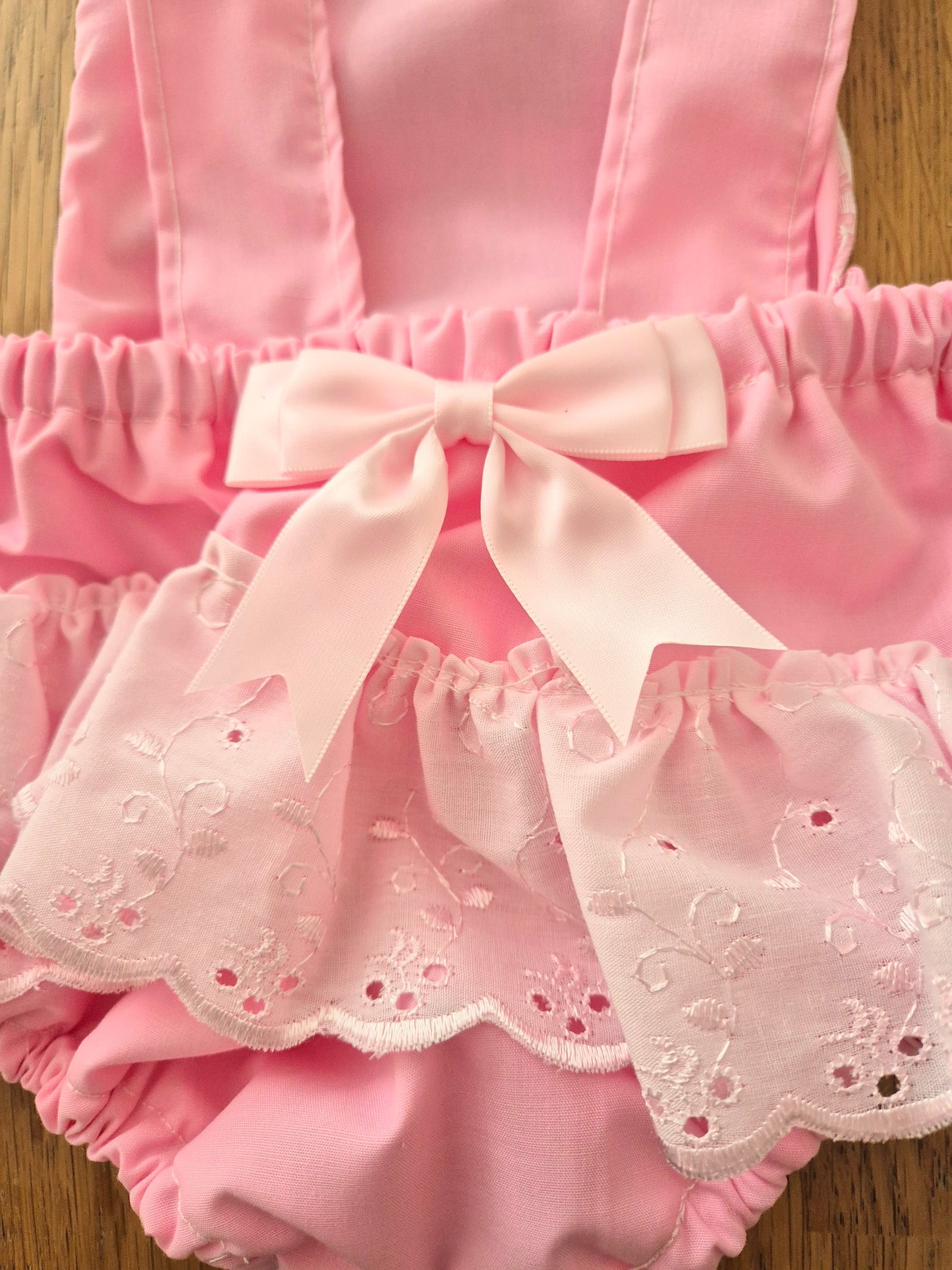 Pink lace front romper suit