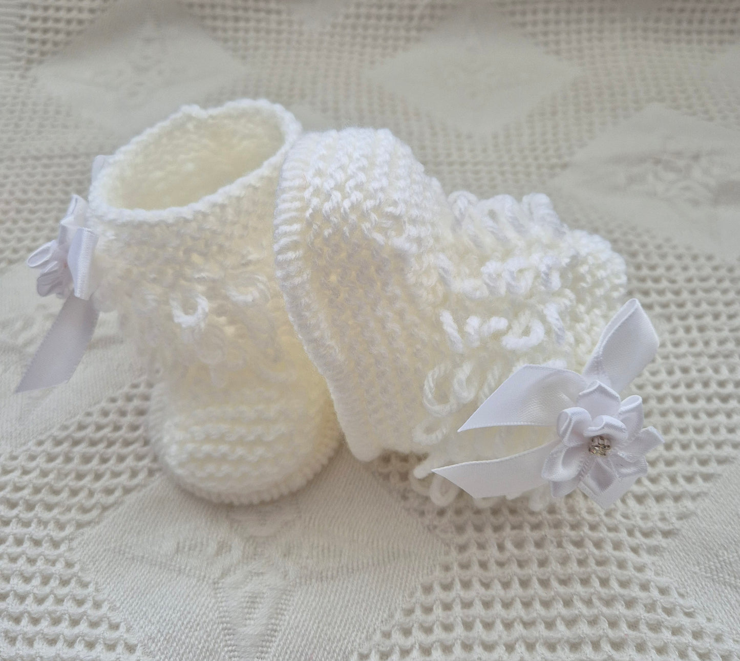 White loopy hat and booties