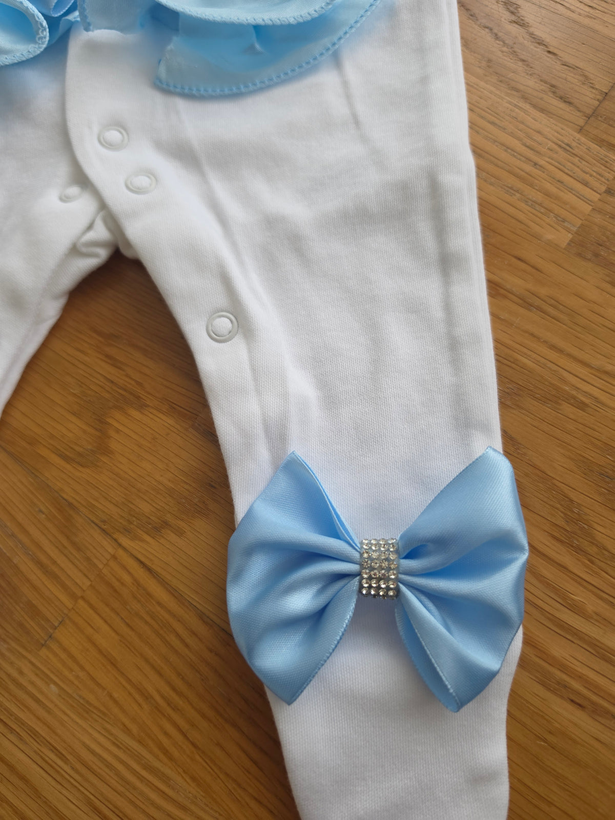 Blue ruffle babygrow