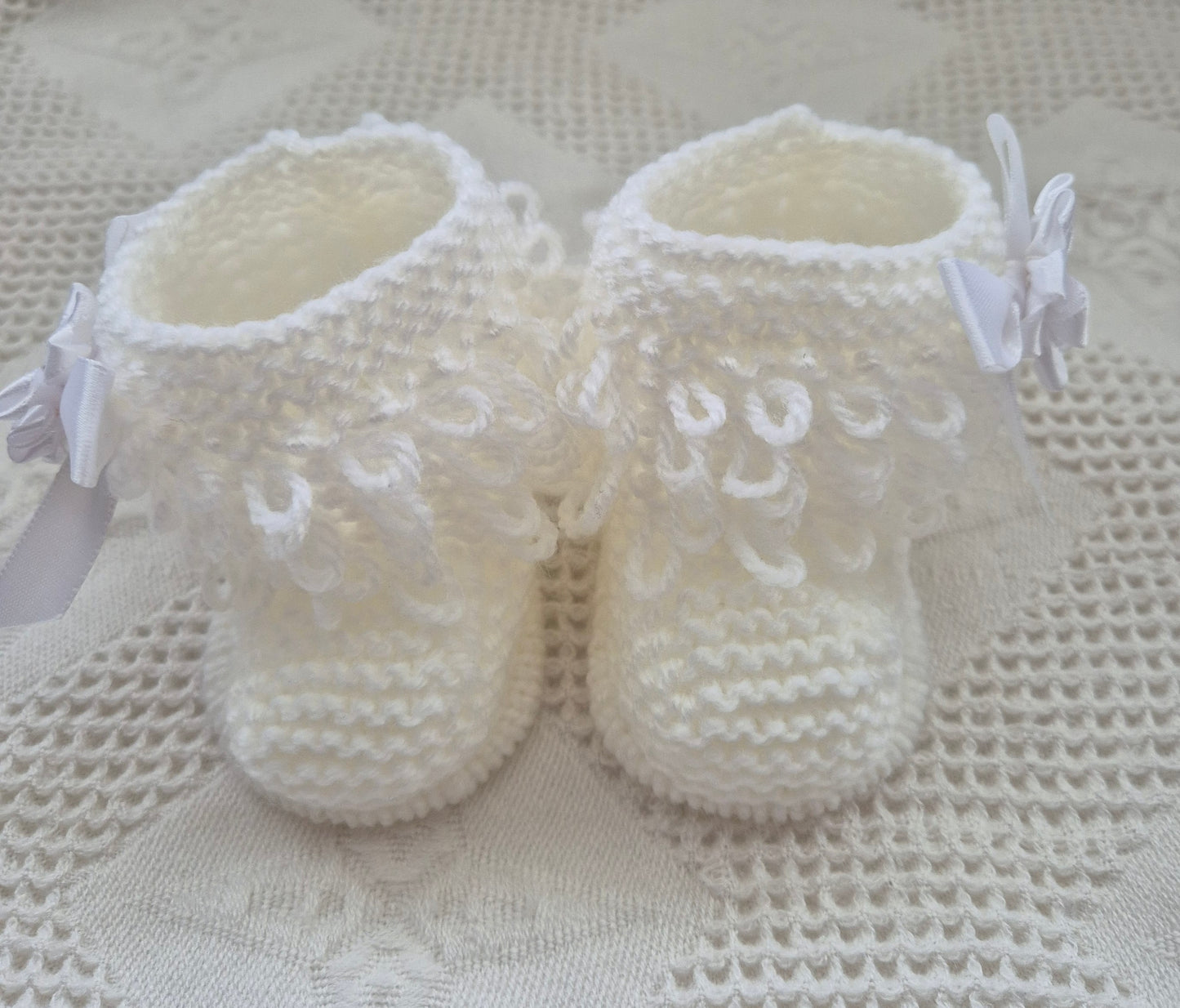 White loopy hat and booties