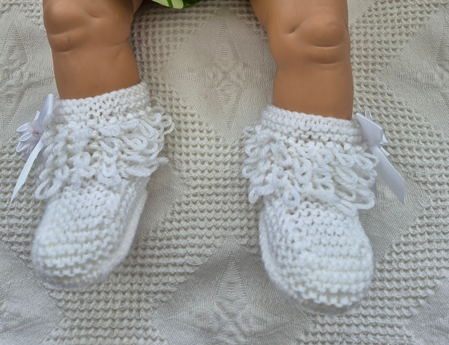 White loopy hat and booties