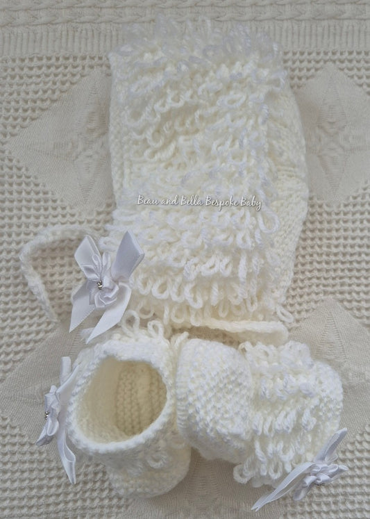 White loopy hat and booties
