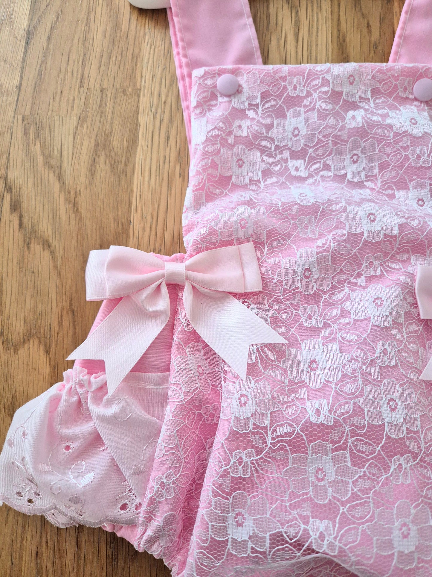 Pink lace front romper suit