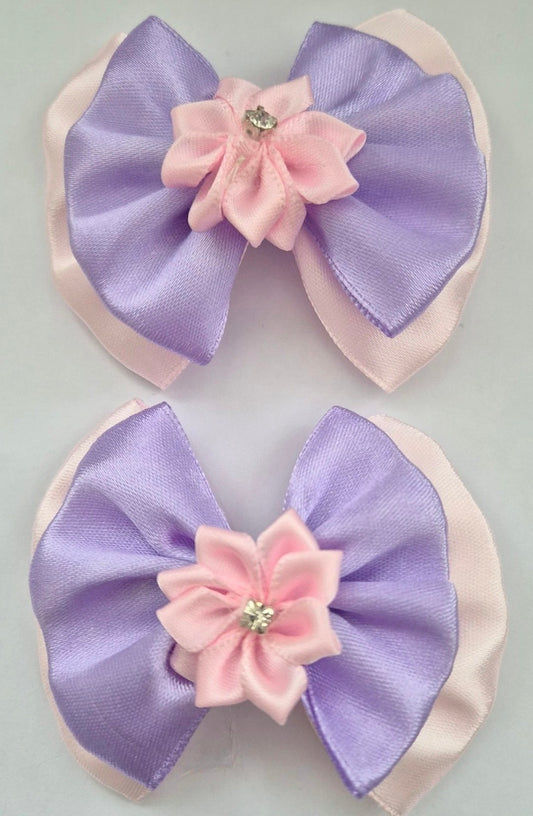 A pair of Lilac and Pink hair bows