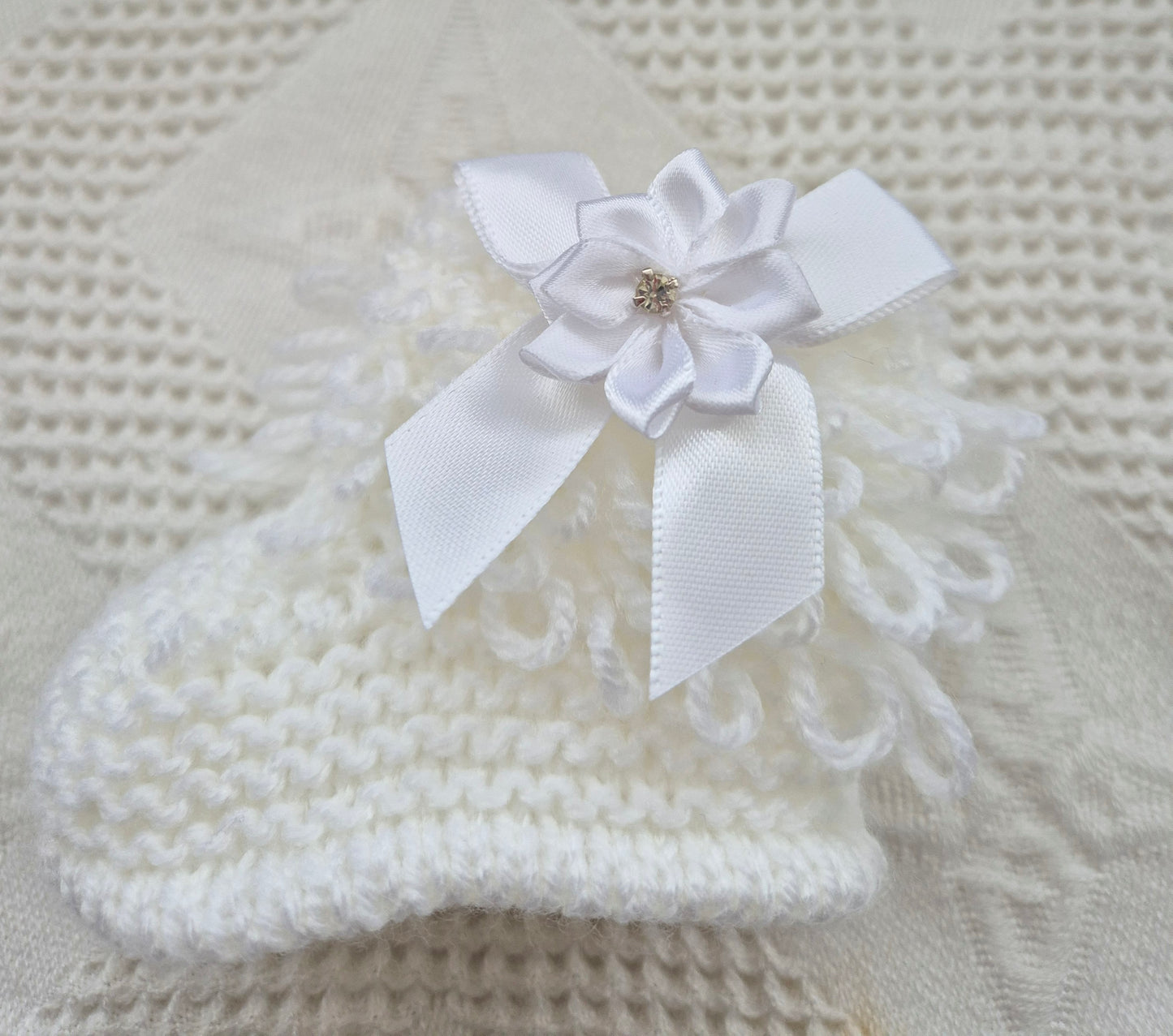 White loopy hat and booties