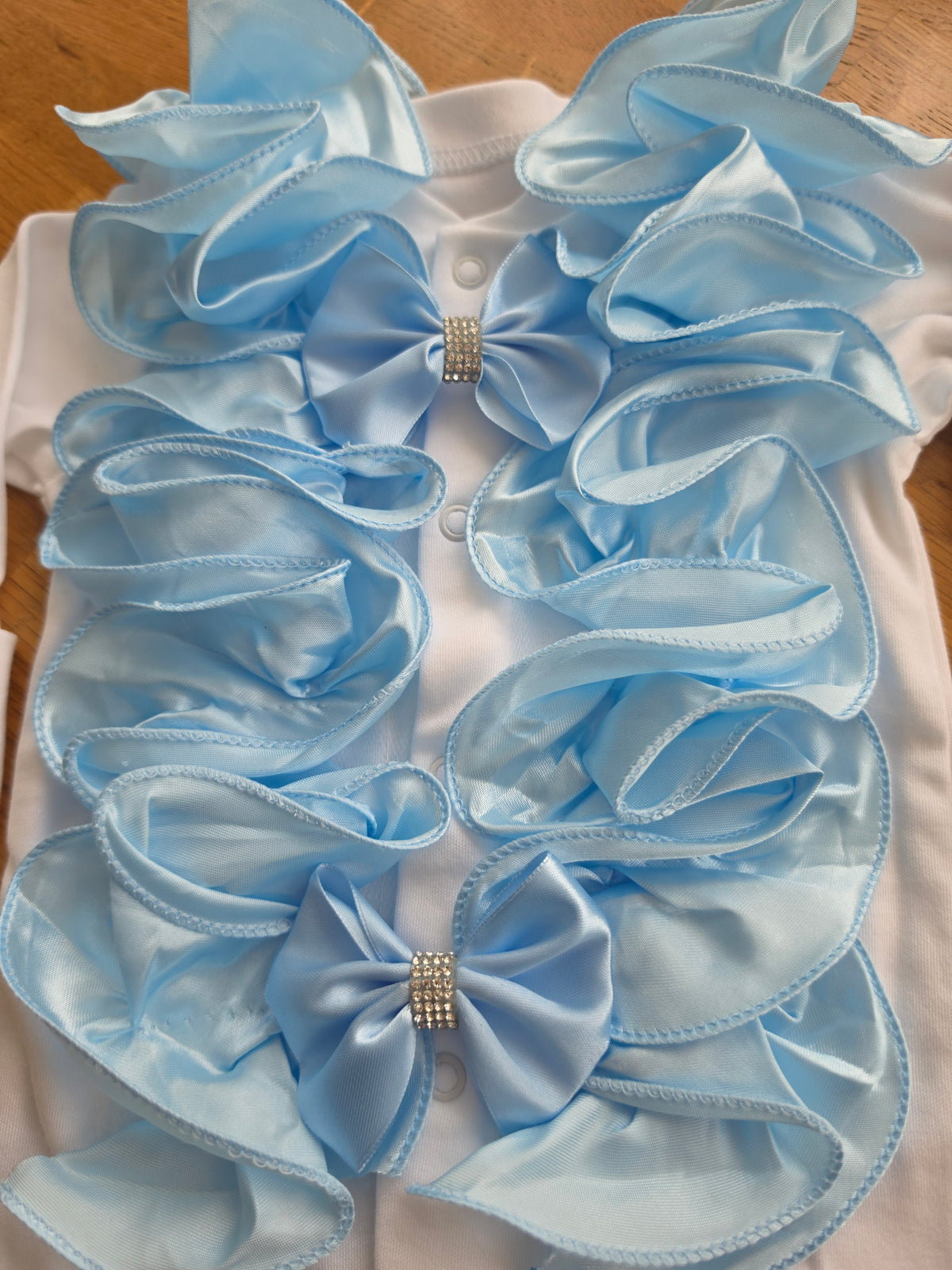 Blue ruffle babygrow