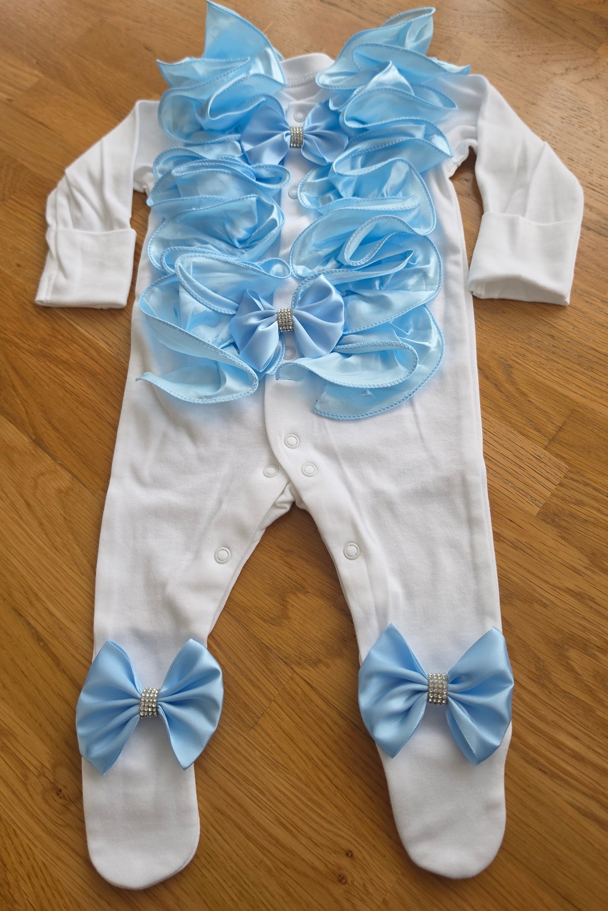 Blue ruffle babygrow