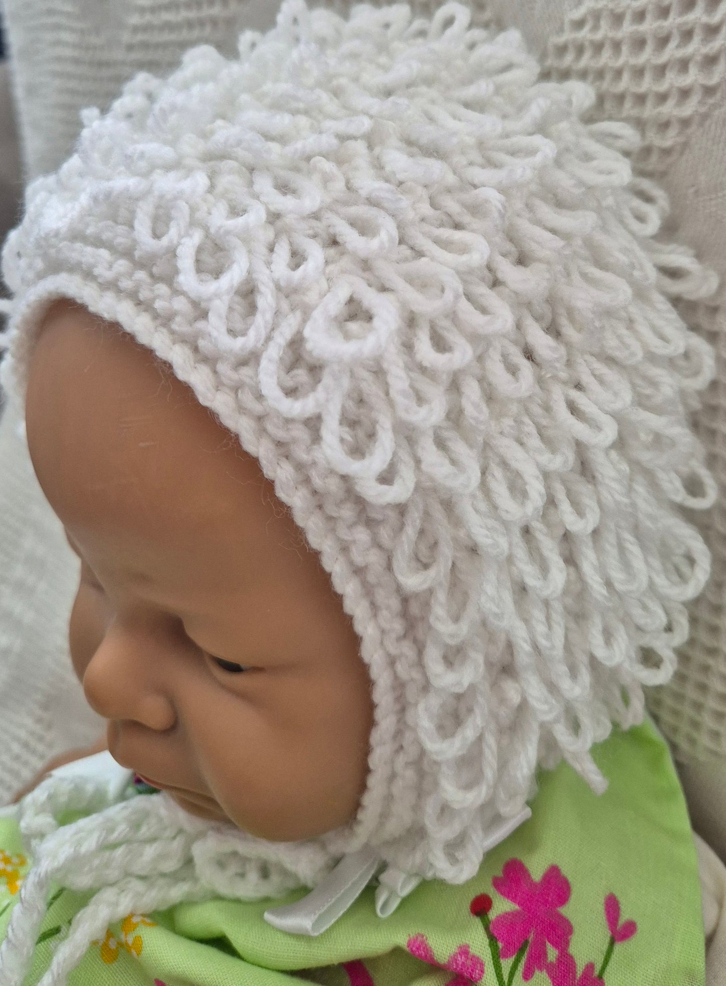 White loopy hat and booties